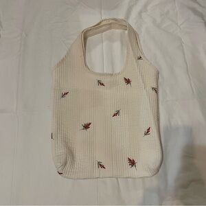 White tote with red flowers
